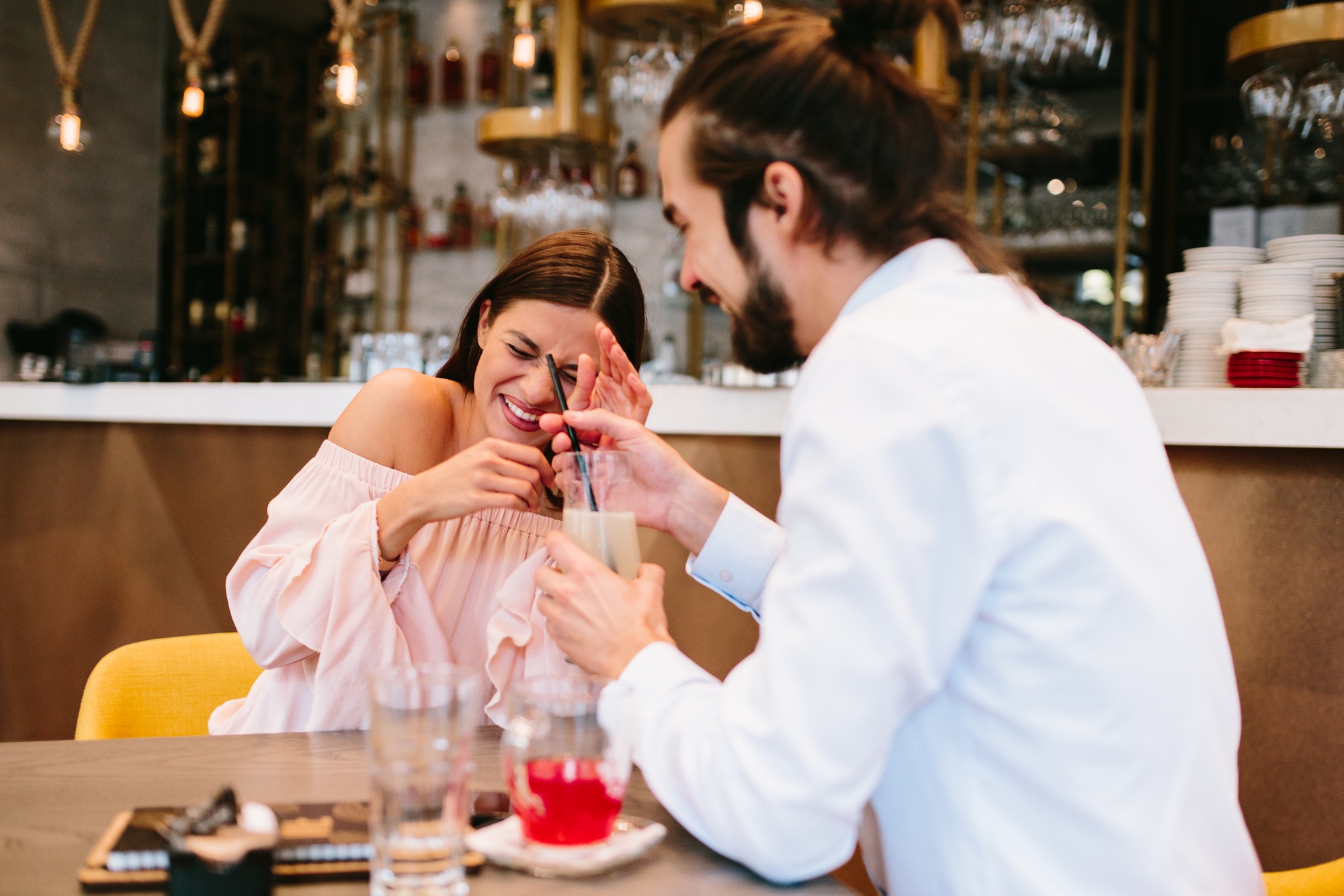 Young happy couple at date in a cafe